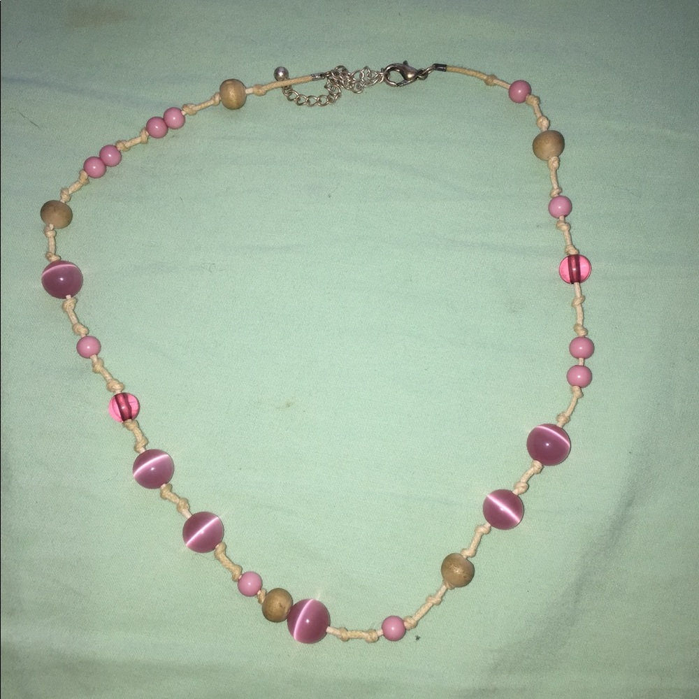 pink and tan colored necklace